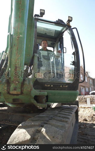 Construction Worker Using Digger