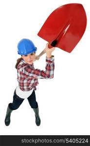 Construction worker wielding a shovel