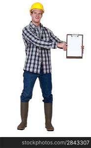 Construction worker with a blank clipboard