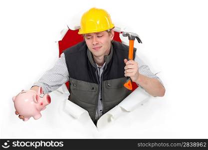 Construction worker with a hammer and piggy bank