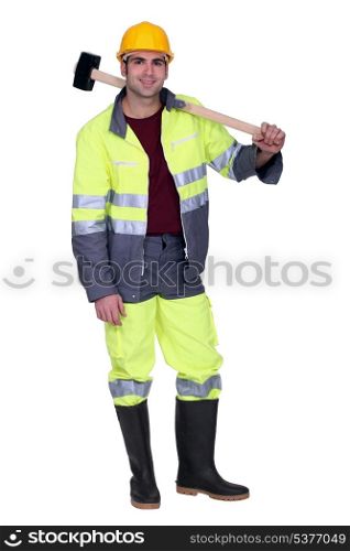 Construction worker with a sledgehammer