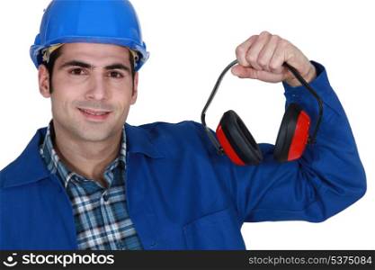 Construction worker with ear defenders
