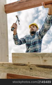construction worker with hammer hard hat building roof house