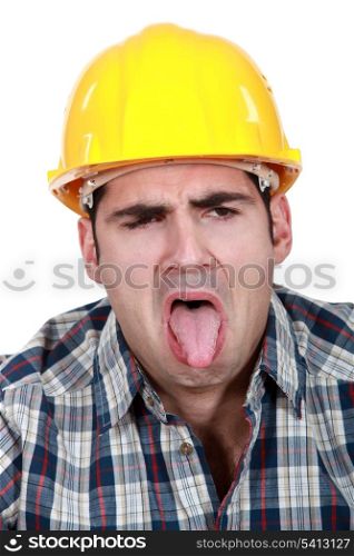 Construction worker with his tongue out