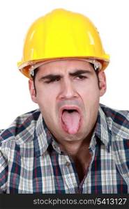 Construction worker with his tongue out