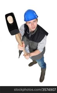 Construction worker with large hammer