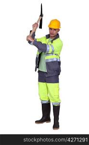 Construction worker with pick-axe