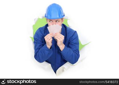 Construction worker with playing cards