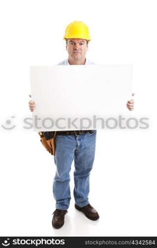 Construction worker with serious expression, holding a blank white sign. Isolated on white, full body.