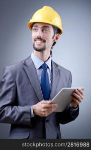 Construction worker working on tablet