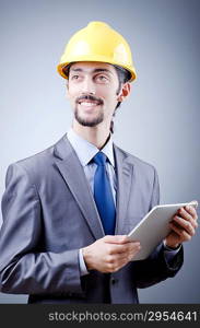 Construction worker working on tablet