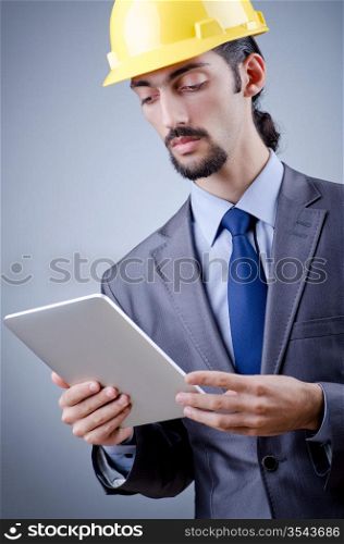Construction worker working on tablet