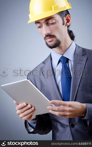 Construction worker working on tablet