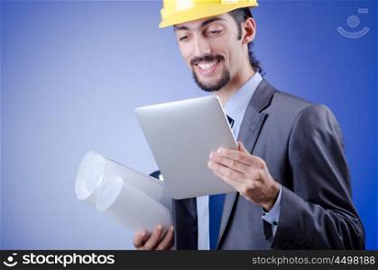 Construction worker working on tablet
