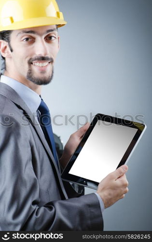 Construction worker working on tablet