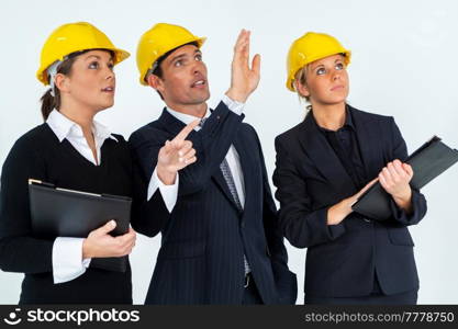 Construction workers, building site team, wearing hard hats on white background