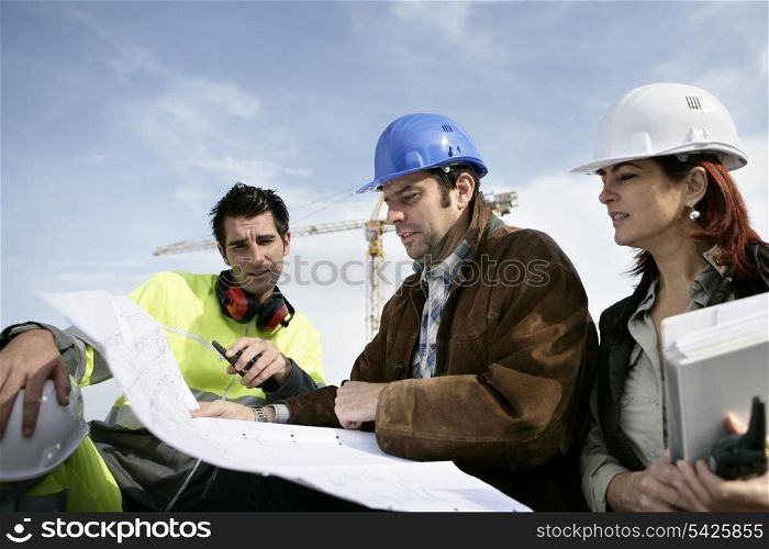 Construction workers discussing plans