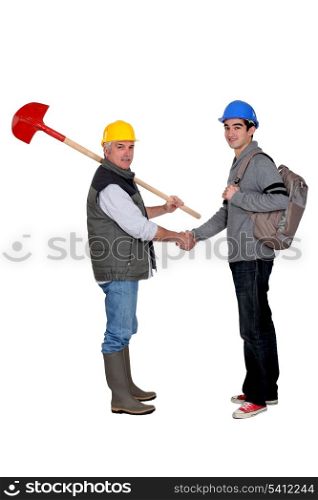 Construction workers handshaking