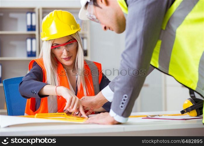 Construction workers having discussion in office before starting. Construction workers having discussion in office before starting project. Construction workers having discussion in office before starting