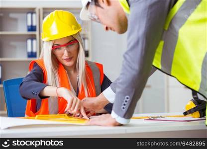 Construction workers having discussion in office before starting. Construction workers having discussion in office before starting project. Construction workers having discussion in office before starting
