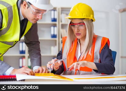 Construction workers having discussion in office before starting project. Construction workers having discussion in office before starting