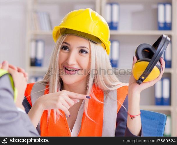 Construction workers having discussion in office before starting project. Construction workers having discussion in office before starting