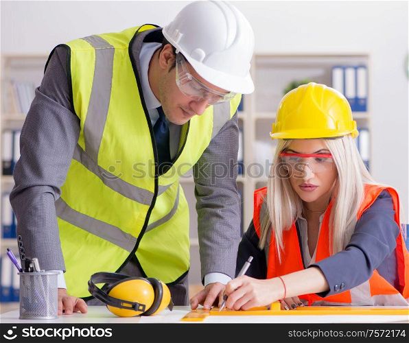 Construction workers having discussion in office before starting project. Construction workers having discussion in office before starting