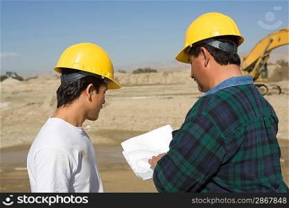 Construction Workers reading blueprint