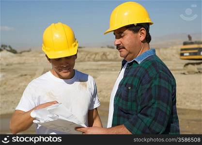 Construction Workers reading blueprint