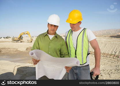 Construction Workers Reading Blueprints