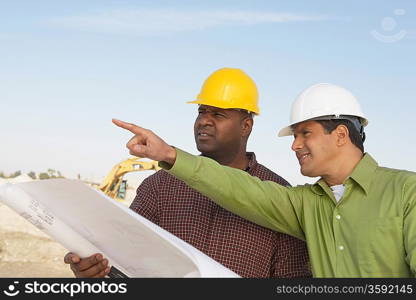 Construction Workers Reading Blueprints