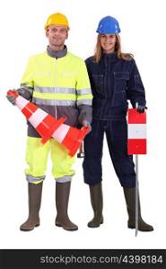 Construction workers with cones