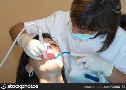 Consulting a dentist during a dental cleaning