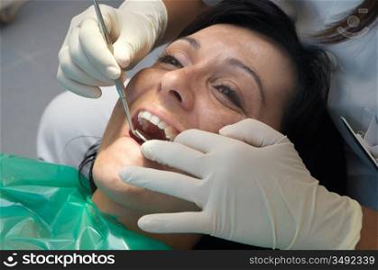 Consulting a dentist during a dental cleaning