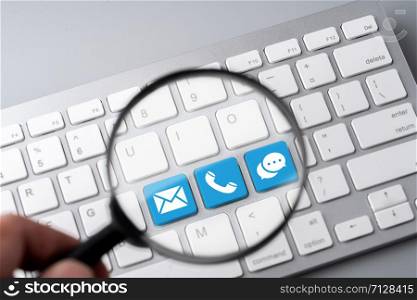 Contact us business icon on computer keyboard in retro style