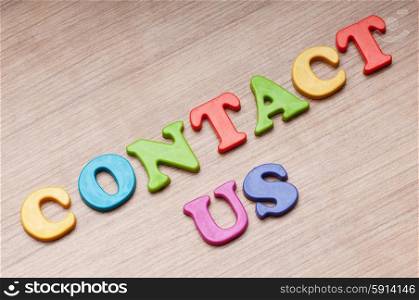 Contact us concept with letters on background