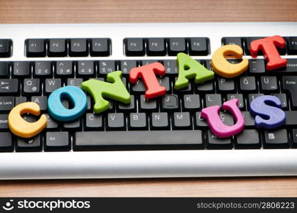 Contact us concept with letters on keyboard