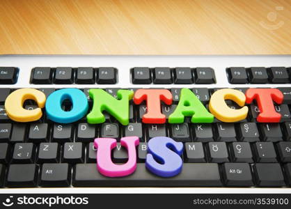 Contact us concept with letters on keyboard