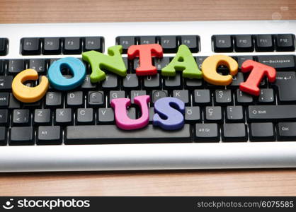 Contact us concept with letters on keyboard