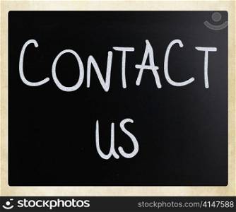 ""Contact Us" handwritten with white chalk on a blackboard"