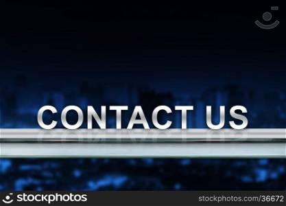 contact us on metal railing with blurred background