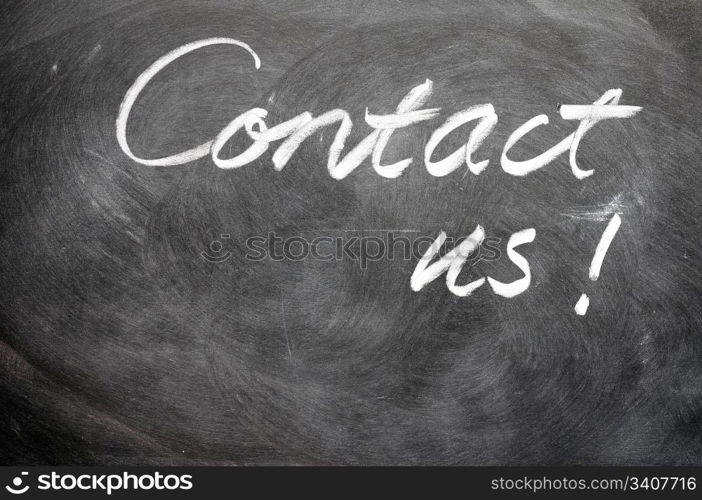 Contact us written with chalk on blackboard