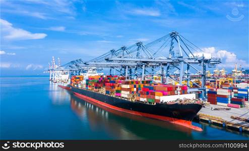 Container cargo ship at industrial port in import export business logistic and transportation of international by container cargo ship in the open sea.