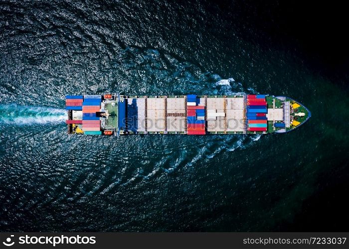 container cargo ship, business freight shipping international by container cargo ship in the sailing open sea at night process aerial view from drone