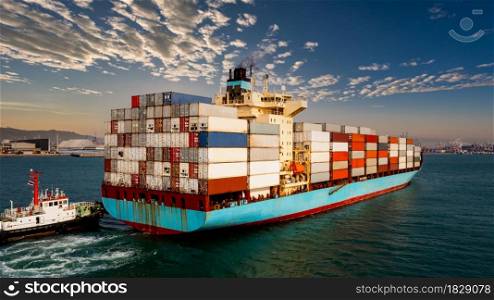 container cargo ship carrying commercial container in import export business commerce logistic and transportation of international by container ship at morning sunlight blue sky or international shipping port background