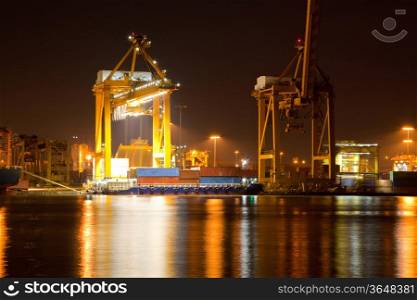 Container Cargo ship with working crane in shipyard at dusk unloading goods for Logistic Import Export background