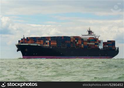Container cargo transport ship sailing at sea