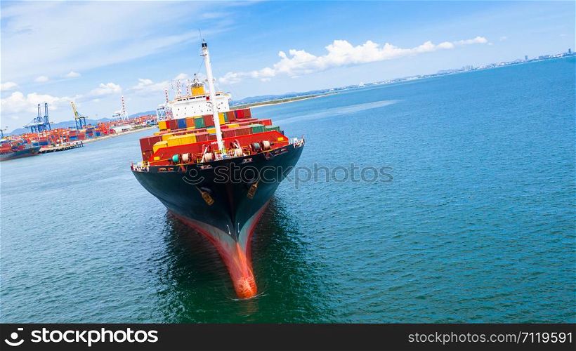 Container ship carrying container in import export business logistic and transportation of international by container ship in the open sea.