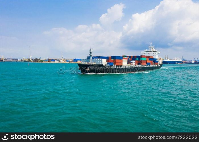 Container ship in export and import business and logistics. Shipping cargo to harbor transport International and shipping port background Thailand