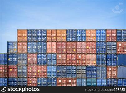 Container ship in export and import business and logistics in harbor industrial packing and water transport International shipping cargo / Box container on blue sky cloud background